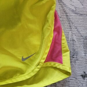 Women's size small Nike dry tempo running shorts pink and neon yellow.